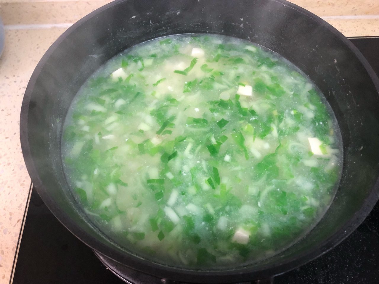 Tofu soup with baby bok choy